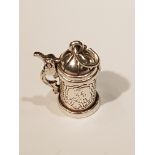 AN ARTICULATED SILVER TANKARD CHARM. (2.4cm including jump ring) 5036/12441/4