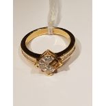 AN 18CT GOLD AND DIAMOND CLUSTER/DRESS RING The square cluster of four Princess cut diamonds, to