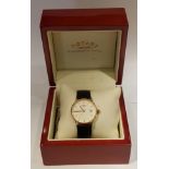 ROTARY, G511876/03, A GENTLEMEN'S 18CT GOLD WRISTWATCH Having a circular cream dial, gilt number