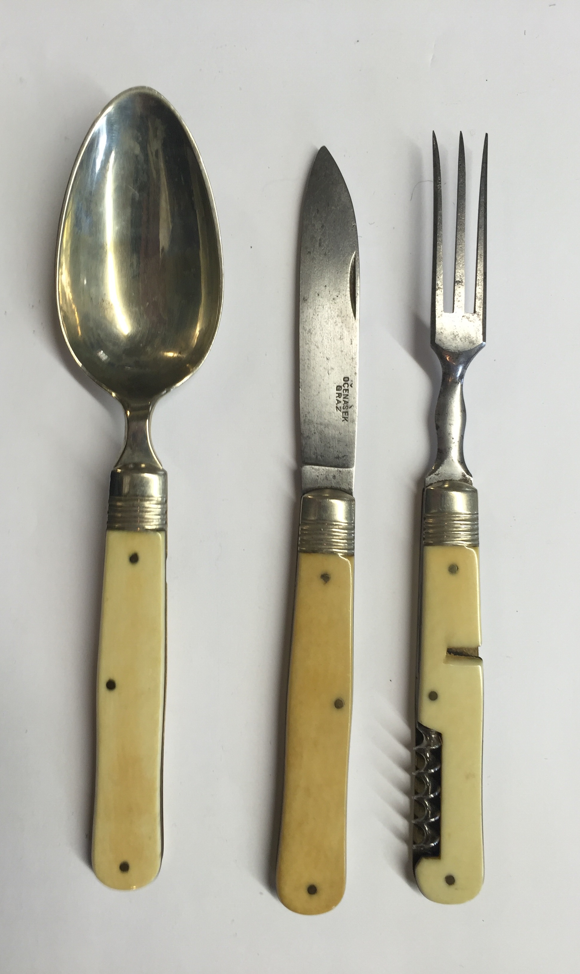 A 19TH CENTURY FOLDING HUNTING KNIFE, FORK AND SPOON With ivory handles.