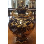 LIMOGES, FRANCE, AN EARLY 20TH CENTURY VASE AND COVER With fine gilded decoration on imperial blue