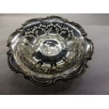 AN EARLY 20TH CENTURY STERLING SILVER TAZZA/DISH Having a scalloped edge with scrolls and flowers,