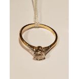 AN EARLY 20TH CENTURY 18CT GOLD AND DIAMOND SOLITAIRE RING The old cut diamond claw set in white