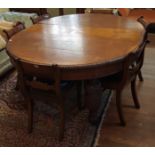 A VICTORIAN OAK DINING TABLE With one extra leaf, raised on five heavily carved turned legs (