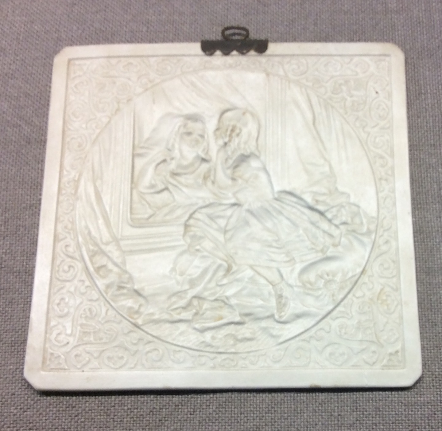 A 19TH CENTURY FINE PORCELAIN LITHOPANE PANEL Moulded to depict a young girl, seated at a dressing