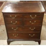 A GEORGIAN MAHOGANY SIDE CABINET With faux drawers, above real drawers, raised on bracket feet and