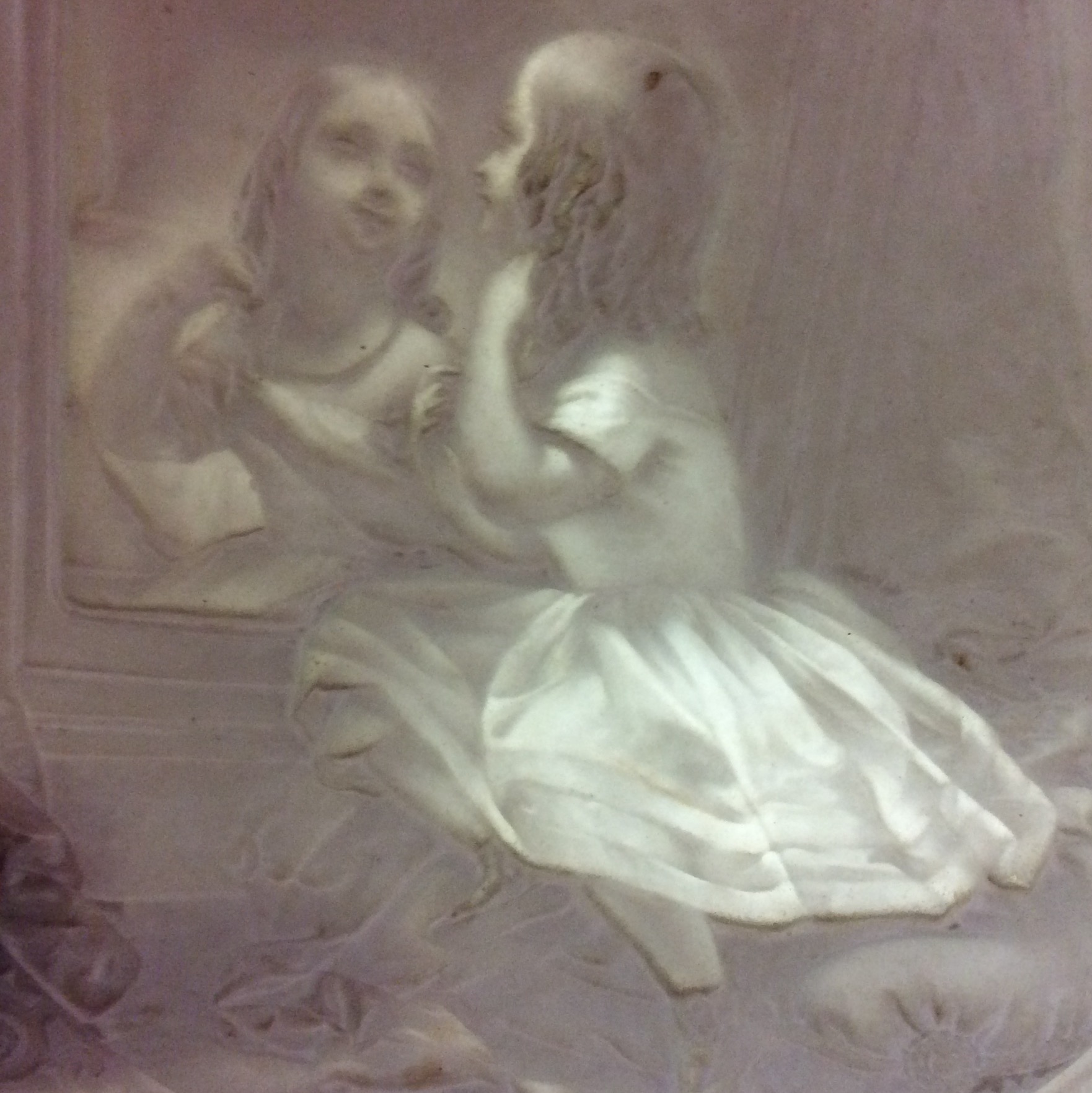 A 19TH CENTURY FINE PORCELAIN LITHOPANE PANEL Moulded to depict a young girl, seated at a dressing - Image 2 of 2