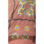 AN EARLY 20TH CENTURY CHINESE SILK AND EMBROIDERED SHAWL With stylised flowers on a salmon pink