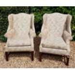 A PAIR OF GEORGIAN DESIGN WING ARMCHAIRS Raised on square legs.
