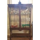 A CHIPPENDALE REVIVAL MAHOGANY DISPLAY CABINET The shell carved cartouche and scroll carved