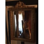 A LATE 19TH/EARLY 20TH CENTURY GILTWOOD AND GESSO ROCOCO STYLE MIRROR Of rectangular form, carved