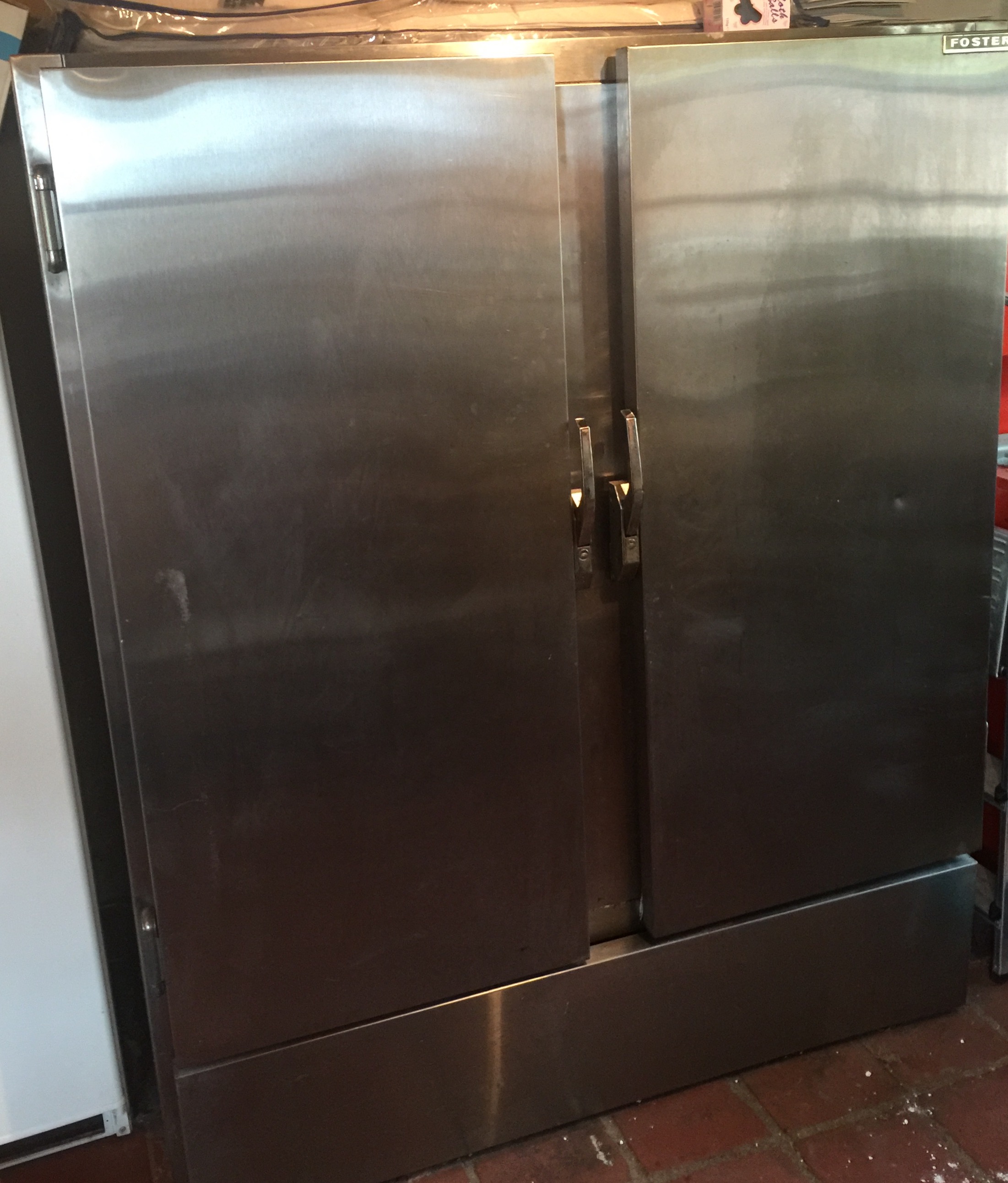 FOSTER, AN INDUSTRIAL DOUBLE STAINLESS STEEL FRIDGE. (approx w 144cm x d 83cm x h 167cm)