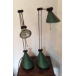 A PAIR OF ANGLEPOISE LAMPS With a green finish, raised on oval bases. (approx h 50cm)