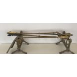 A SET OF THREE BRASS FIRE IRONS AND DOGS Including a shovel, poker and tong, having a fluted handle,
