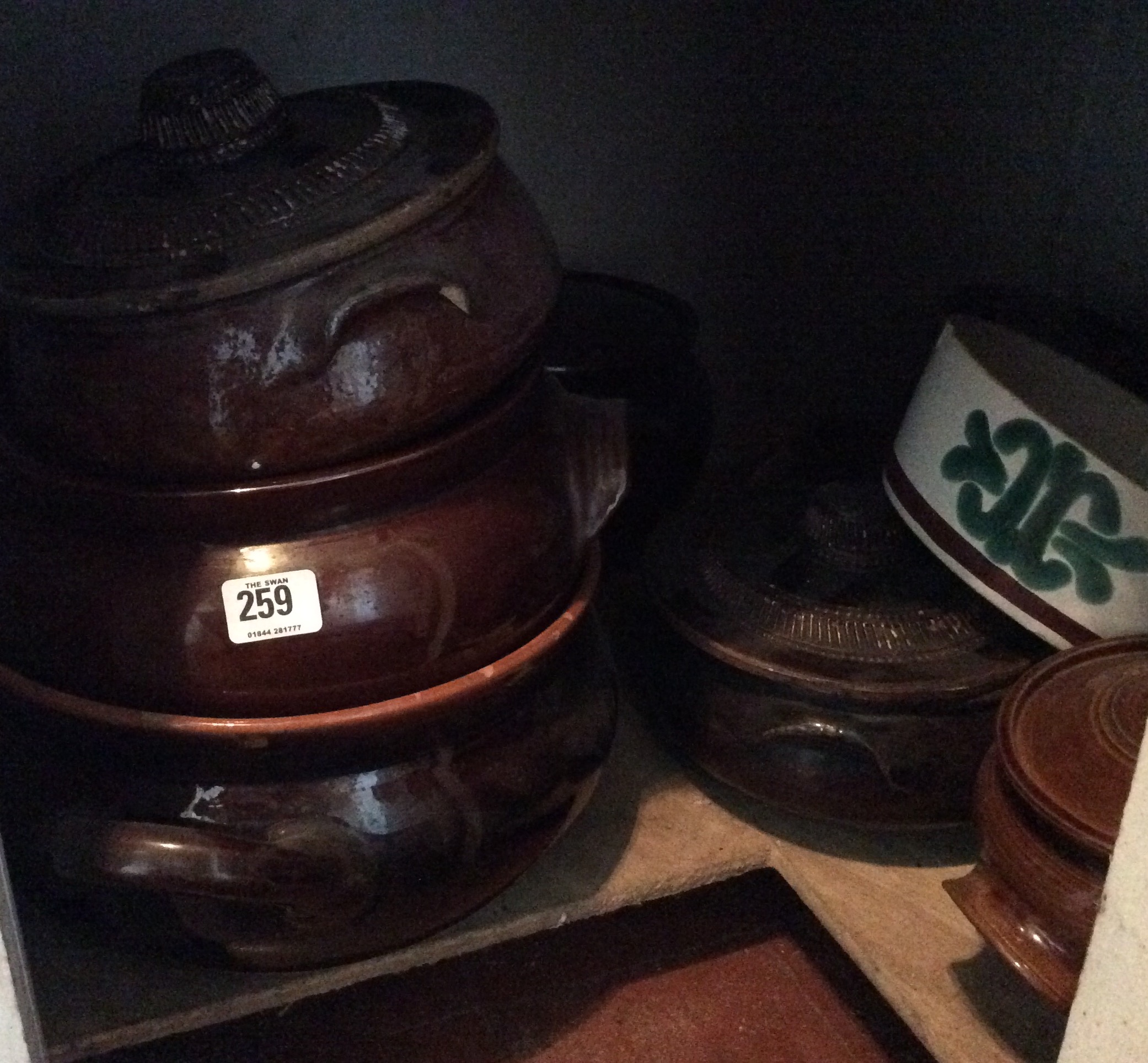 A COLLECTION OF VINTAGE STONEWARE CIRCULAR GRADUATING CASSEROLE DISHES.