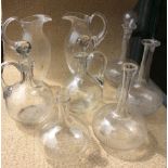 A COLLECTION OF CRYSTAL GLASSES Eleven wine goblets, six tumblers, two pairs of claret jugs and