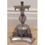 A 19TH CENTURY WHITE METAL CONTINENTAL LAMP BASE Figured with three elephants. (30cm)