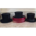 AN OPERA HAT Along with two top hats.