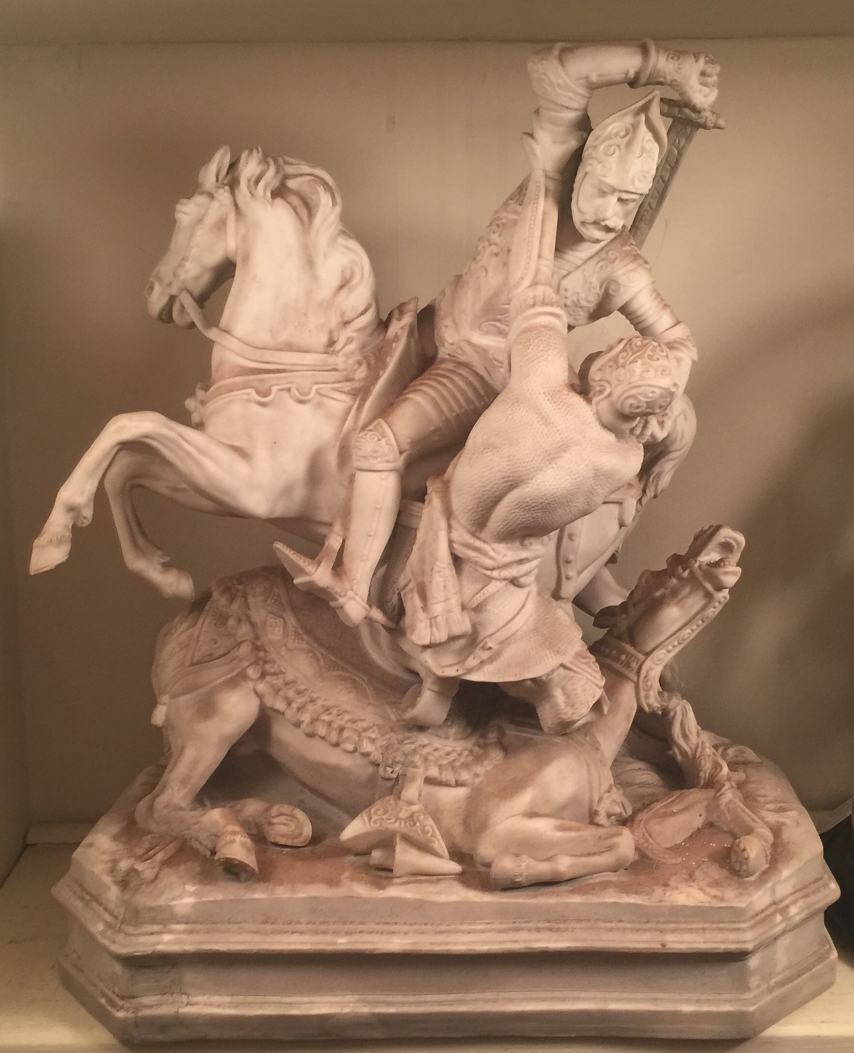 A 19TH CENTURY PARIAN GROUP Warriors at battle. (30cm x 36cm) Condition: restored