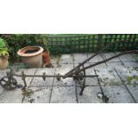 AN ANTIQUE IRON ROTAVATOR. (approx 250cm)