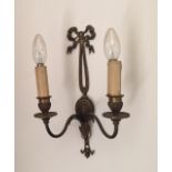 A SET OF THREE BRASS ADAM STYLE TWO BRANCH WALL SCONCES Circular drip trays, rams' heads and bow