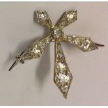 A VICTORIAN PERIOD DIAMOND AND WHITE METAL 'SNOWFLAKE' BROOCH The asymmetric radiant five branch