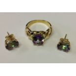 A 9CT GOLD AND MYSTIC TOPAZ DRESS RING AND MATCHING STUD EARRINGS Ring comprises an oval cut ruby