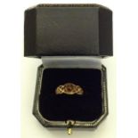 A 9CT GOLD CELTIC DESIGN RING Set with amber cabouchon, stamped '375' (size K).