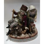 SITZENDORF, A LATE 19TH/EARLY 20TH CENTURY GERMAN PORCELAIN FIGURAL GROUP Of a woodcutter and