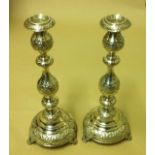 A MID 19TH CENTURY PAIR OF HALLMARKED SILVER CANDLESTICKS The ornate baluster and knop column, on