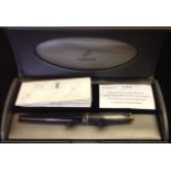 A PARKER FOUNTAIN PEN In glass black and graphite grey, cased with papers, from the British