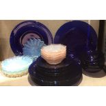 A COLLECTION OF 20TH CENTURY COBOLT BLUE GLASS SERVING PLATES, DISHES AND BOWLS The seven large