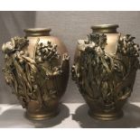 A PAIR OF 19TH CENTURY ORIENTAL BRONZE VASES Decorated with birds amongst foliage. (33cm x 23cm)