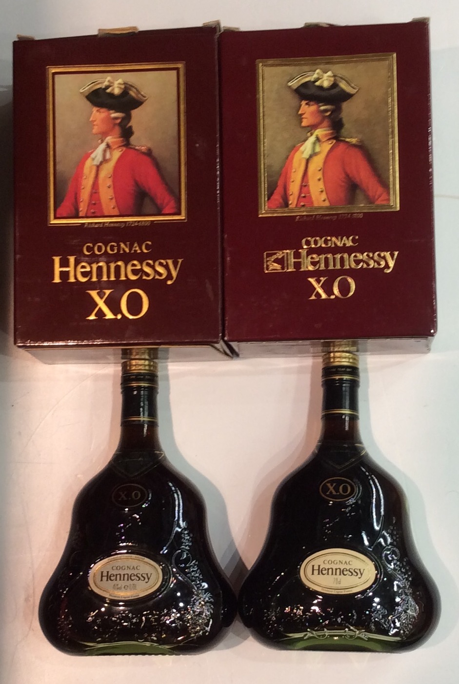 X.O. HENNESSY COGNAC, TWO PEAR FORM BOTTLES Moulded with grapes and vines, retaining original