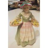 'DAFFY DOWN DILLY', A ROYAL DOULTON FIGURINE Of a Victorian style lady, in a green dress and