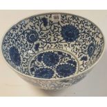 A LARGE CHINESE BLUE AND WHITE PORCELAIN BOWL Decorated with stylized flowers, bearing a six
