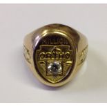 A HEAVY 14CT GOLD AND DIAMOND SET SIGNET RING The oval bezel inset with a brilliant cut diamond to