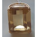 A FRENCH 18CT GOLD AND CITRINE COCKTAIL/DRESS RING The large rectangular step cut citrine, in a four