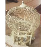 A MID 20TH CENTURY CREAM PAINTED WIREWORK BIRD CAGE Along with a set of four glass door knobs. (54cm