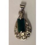 AN 18CT WHITE GOLD, EMERALD AND DIAMOND DROP PENDANT The rectangular step cut emerald claw set to