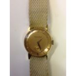 JEAGER LE COULTRE, A GENTLEMEN'S MID 20TH CENTURY 18CT GOLD WRISTWATCH The circular bronze