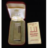 DUNHILL, A SILVER PLATED ROLLAGAS 1968 LIGHTER Cased with directions. (6.2cm x 2.3cm x 1.1cm)