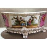 A LARGE 19TH CENTURY BERLIN PORCELAIN OVAL CENTREPIECE BOWL Having pink ground panels, painted