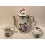 HEREND, AN EARLY 20TH CENTURY PORCELAIN COFFEE POT, SUGAR BASIN AND CREAM JUG Of baluster form, a