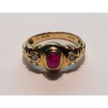 A VINTAGE 18CT GOLD, RUBY AND DIAMOND RING The oval cabouchon cut ruby, in a stepped collet setting,