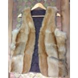 THREE VINTAGE FUR ITEMS To include a fox stole, a mink handbag with leather detail and a goat fur