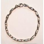 A 9CT WHITE GOLD FANCY LINK BRACELET The elongated oval shaped links, with one small and one