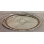 AN EARLY 20TH CENTURY CONTINENTAL OVAL SILVER PLATED TRAY With ribbed and engraved decoration, the