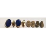 A PAIR OF VINTAGE 9CT GOLD AND LAPIS LAZULI CUFFLINKS Of oval form, set in plain gold mounts and