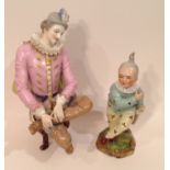 TWO 19TH CENTURY CONTINENTAL PORCELAIN FIGURES One Vienna porcelain, a seated gentleman in